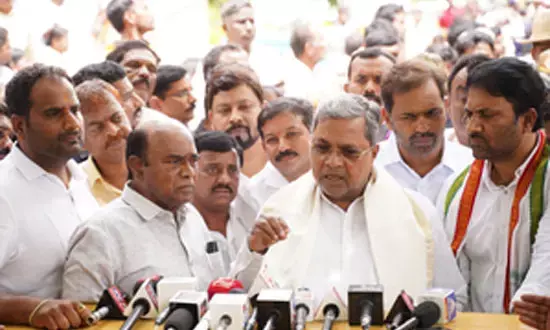 Land Scam Dogs Siddaramaiah
