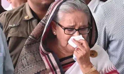 STUDENTS WIN, HASINA FLEES